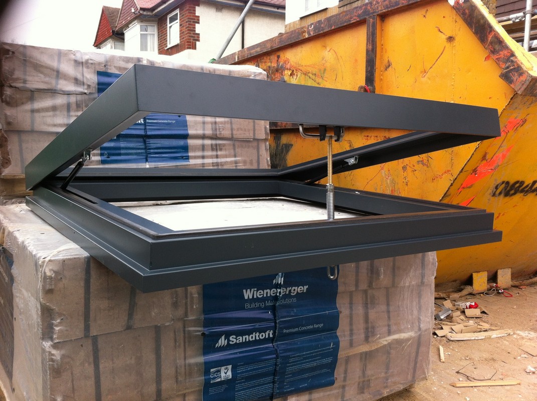 Opening flat roof skylight in anthracite grey installed in Forest Hill