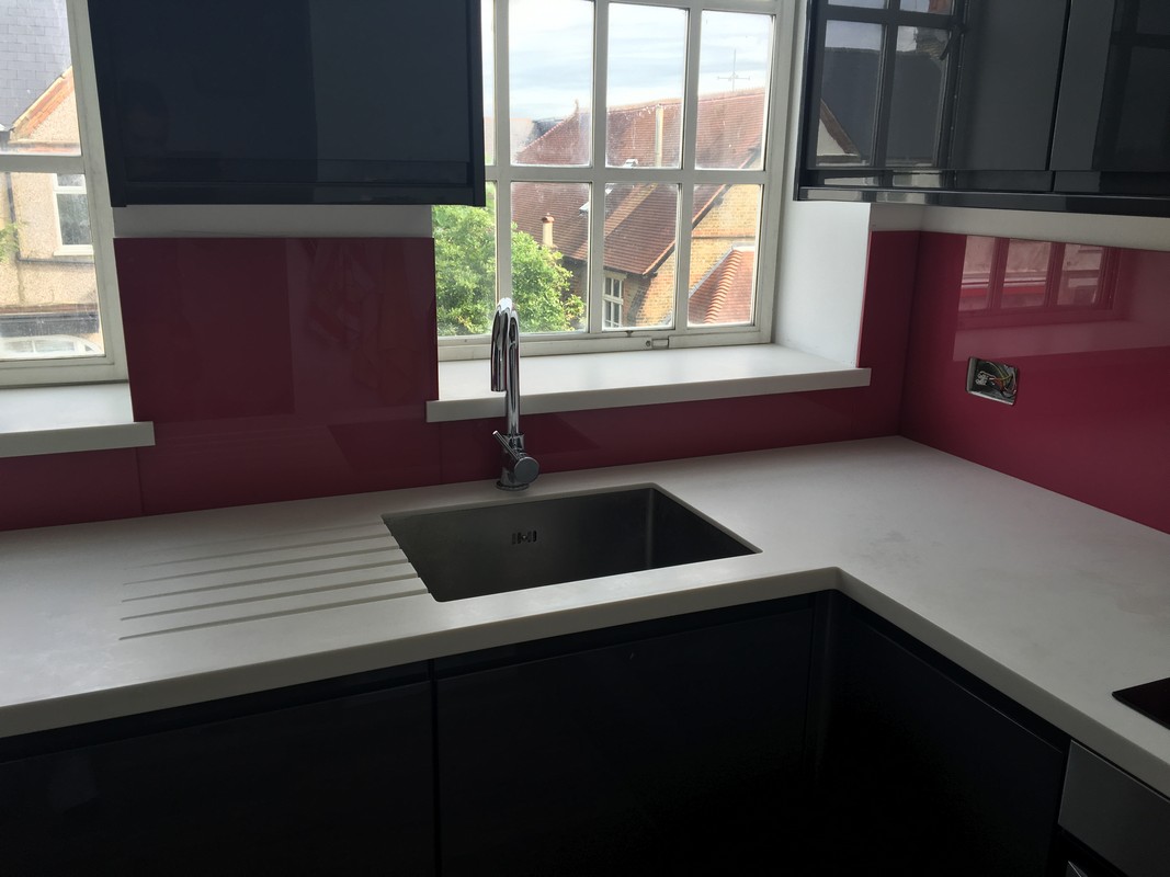 Deep plum coloured glass splashback in modern Forest Hill kitchen